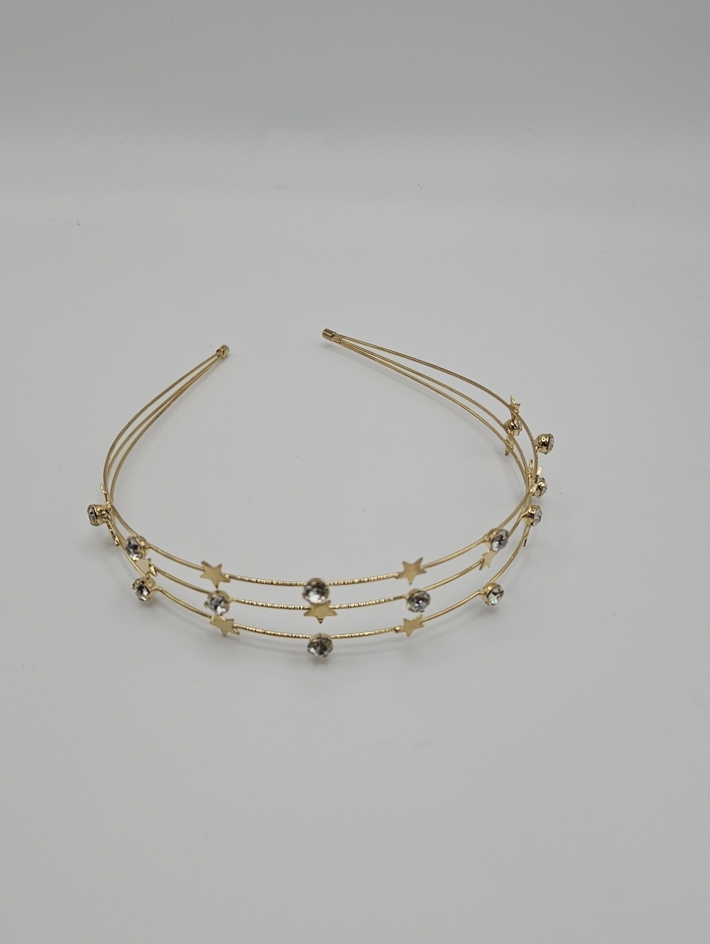 gold tone wire headband with stars and rhinestones
